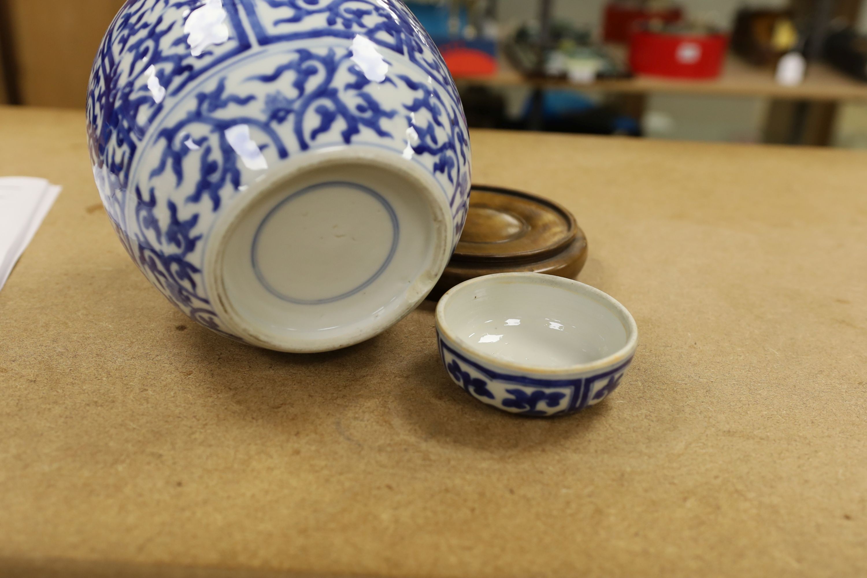 A pair of Chinese blue and white ginger jars and covers, 22cm, On stands